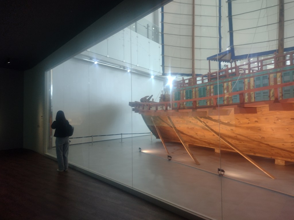 View of exhibition window out onto replica envoy ship.